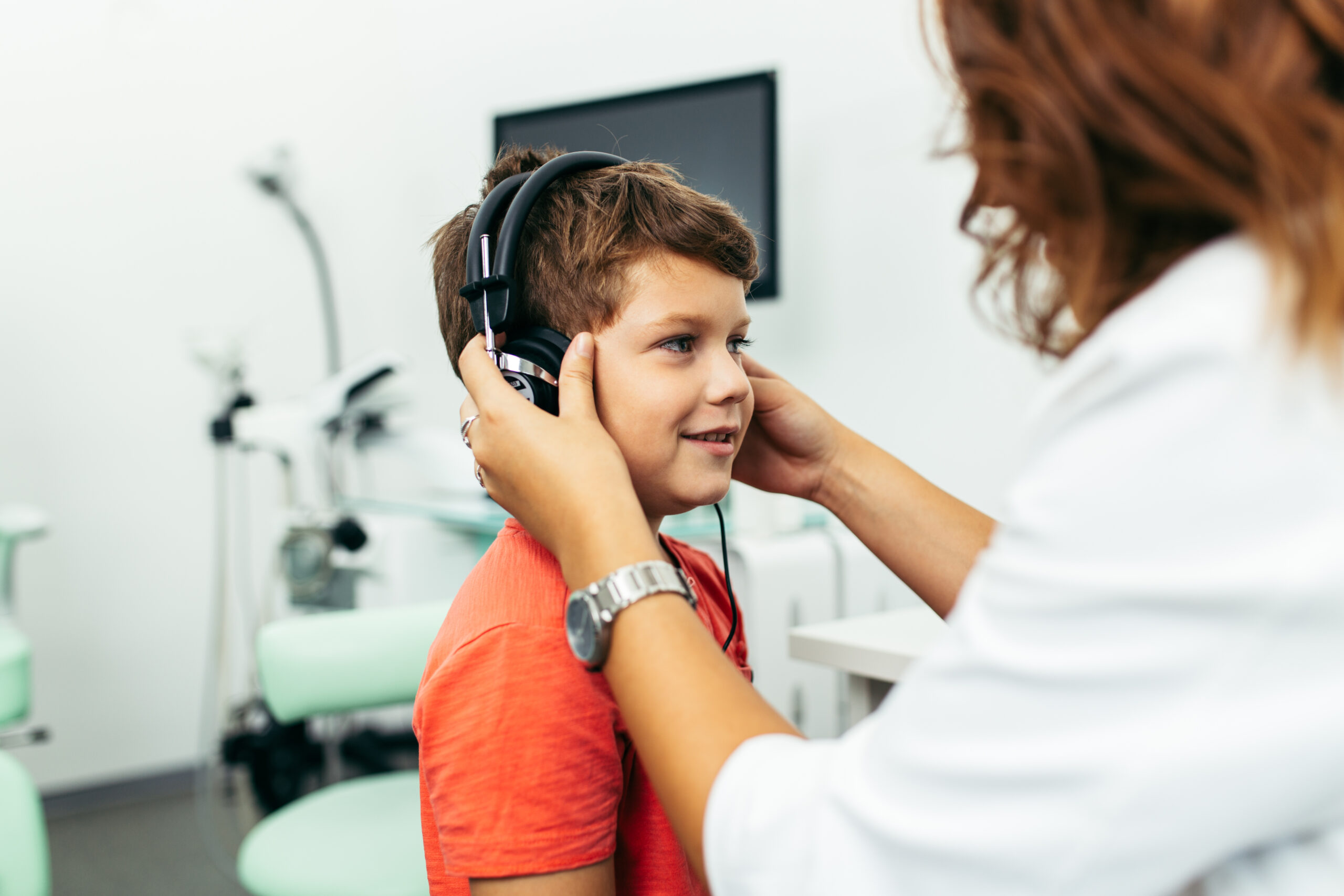 A child wearing headphones during a hearing assessment